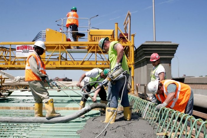 Workers on a construction site. Engineering and architectural ...
